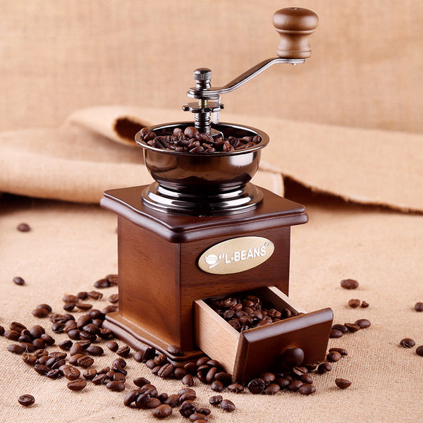 Vintage coffee grinder.Old retro hand-operated wooden and metal