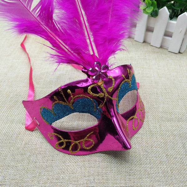 Glitter & Glowing Feather Mask with Just the Right Amount of Sparkle